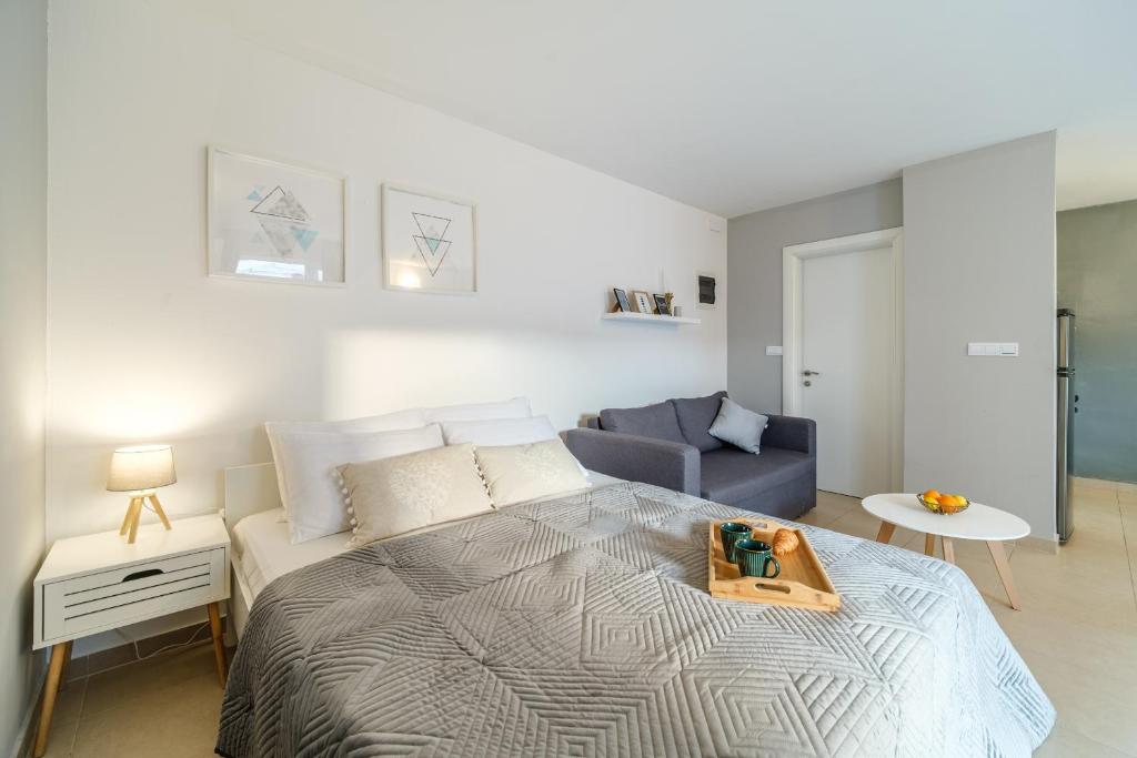 Postel nebo postele na pokoji v ubytování Apartments Tomy