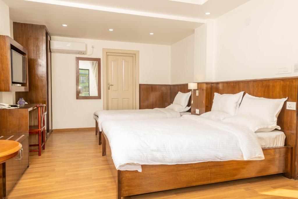 Postel nebo postele na pokoji v ubytování YULOKO GUEST HOUSE