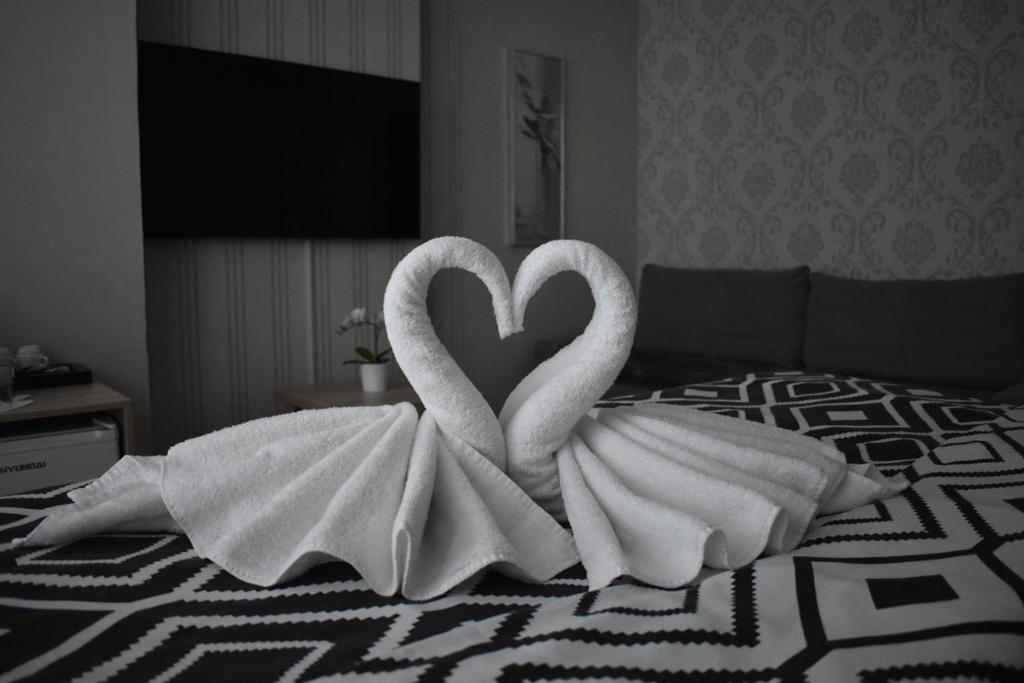 Łóżko lub łóżka w pokoju w obiekcie Hotel Boršičanka