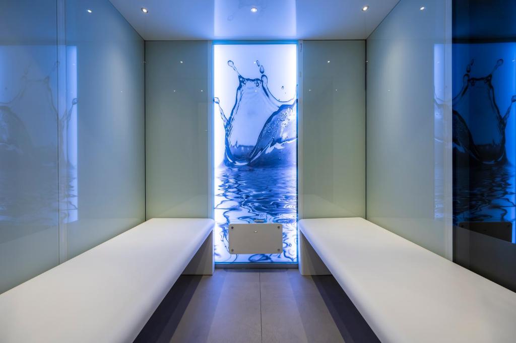 A bed or beds in a room at VIZUALIZA Residence Hotel