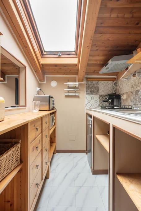 A kitchen or kitchenette at Lo chalet di Giulia - Romantic terrace