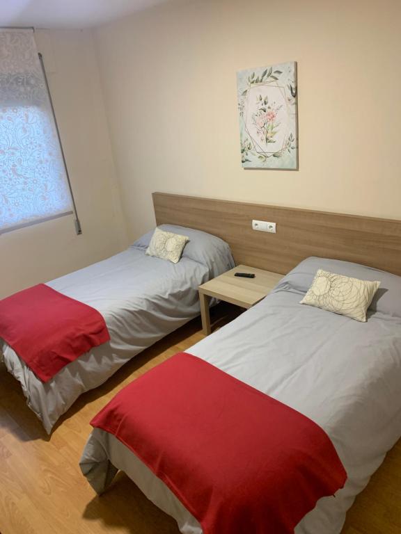 Postel nebo postele na pokoji v ubytování Pension Valcarce