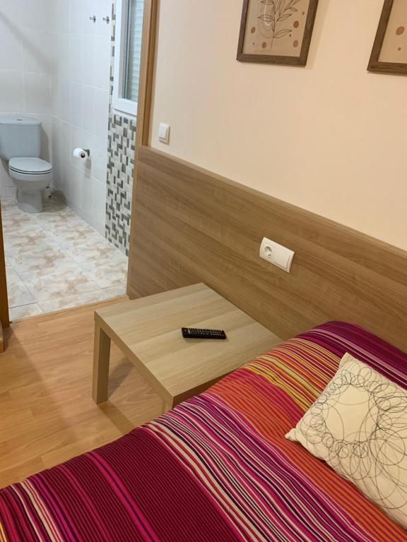 Postel nebo postele na pokoji v ubytování Pension Valcarce
