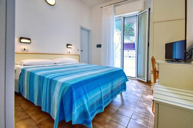 Postel nebo postele na pokoji v ubytování Hotel Vienna