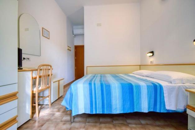 Postel nebo postele na pokoji v ubytování Hotel Vienna