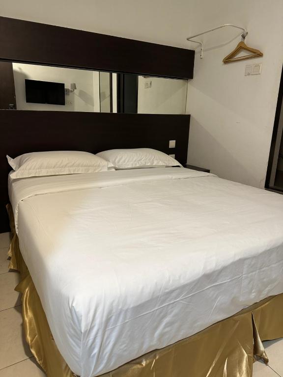 Postel nebo postele na pokoji v ubytování Uptown Chinatown