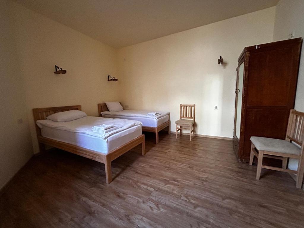 Postel nebo postele na pokoji v ubytování Saryan Guesthouse
