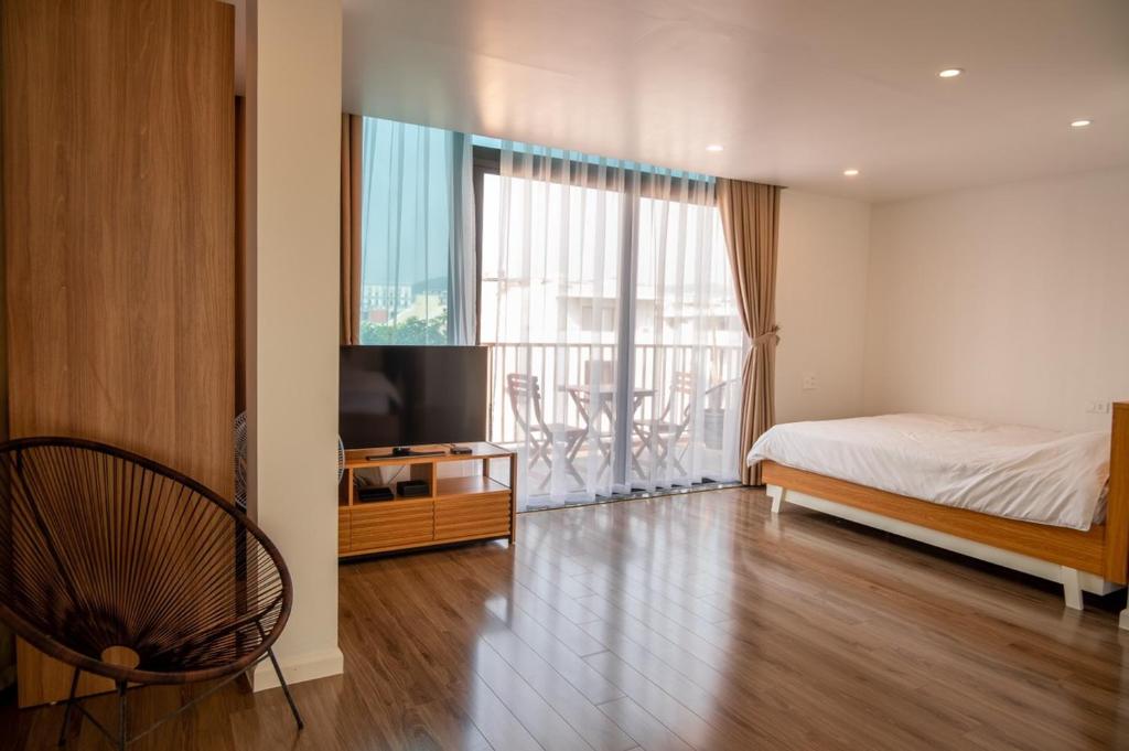 Postel nebo postele na pokoji v ubytování Haradise Suite Villa & Homestay Ha Long