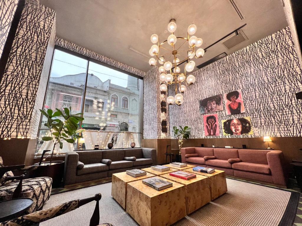 a living room with couches and a coffee table at Root Karaköy in Istanbul