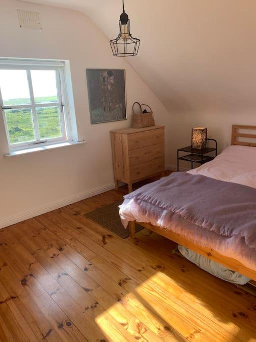 Postel nebo postele na pokoji v ubytování Pink Cottage