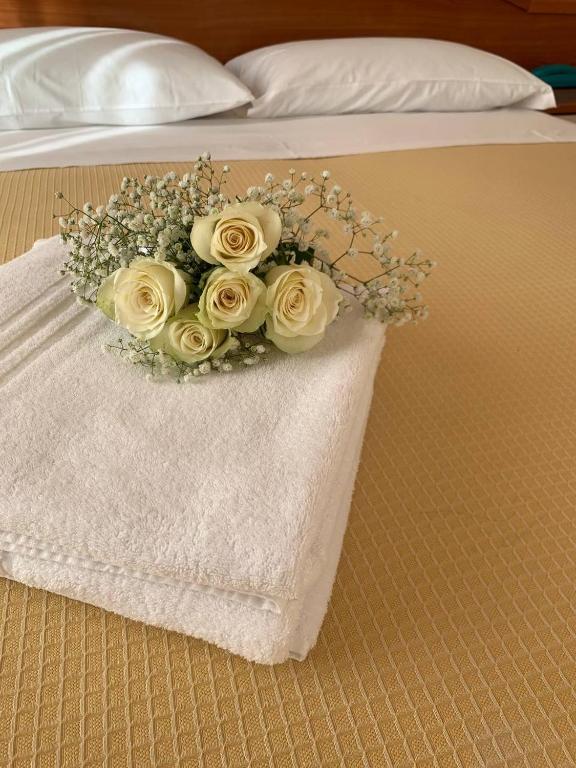 Łóżko lub łóżka w pokoju w obiekcie Hotel Villa Caterina