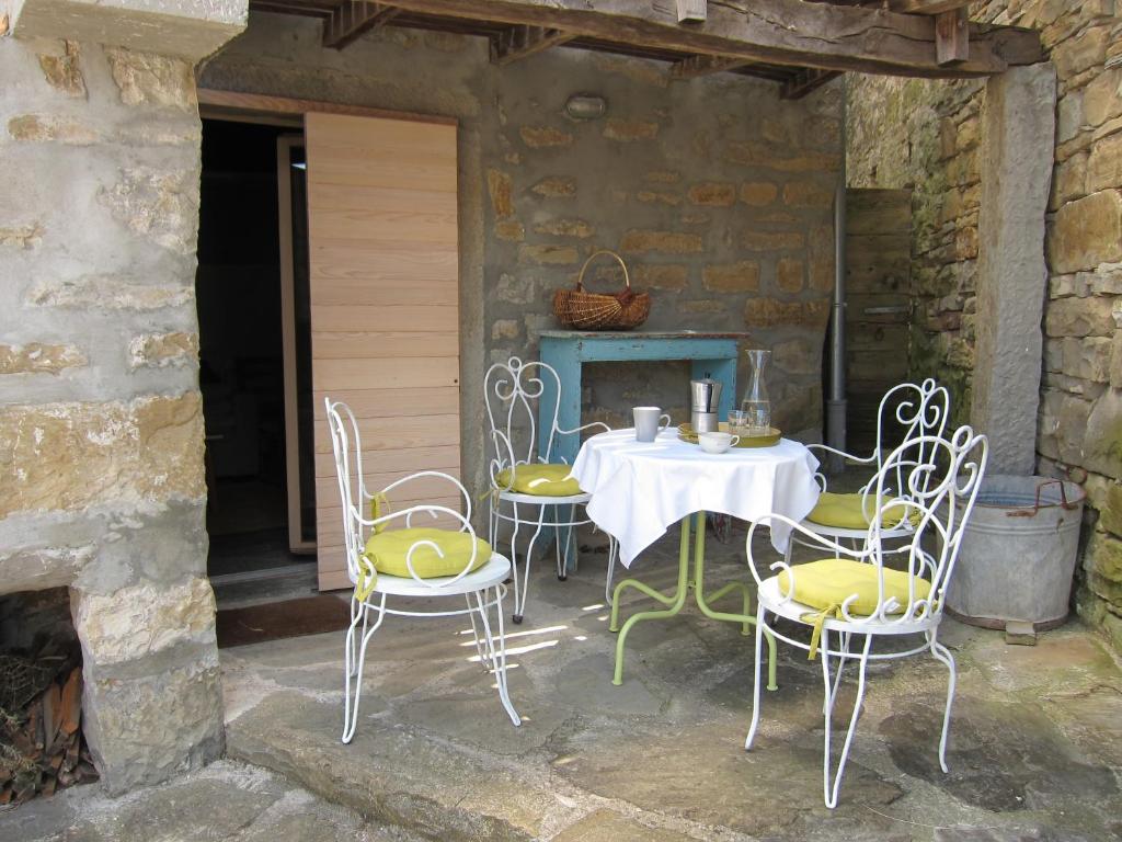a table and chairs sitting on a patio at Flori Adriatic in Marezige