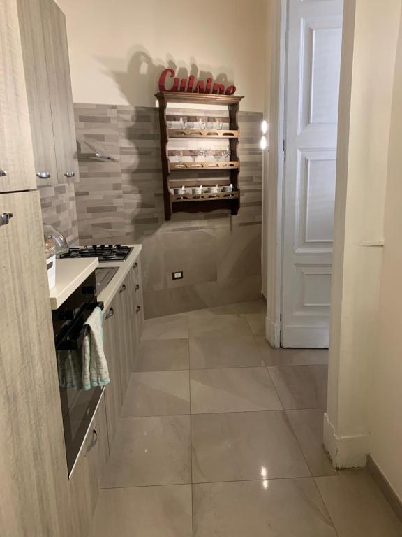 A kitchen or kitchenette at FORIA 58 APARTAMENTS