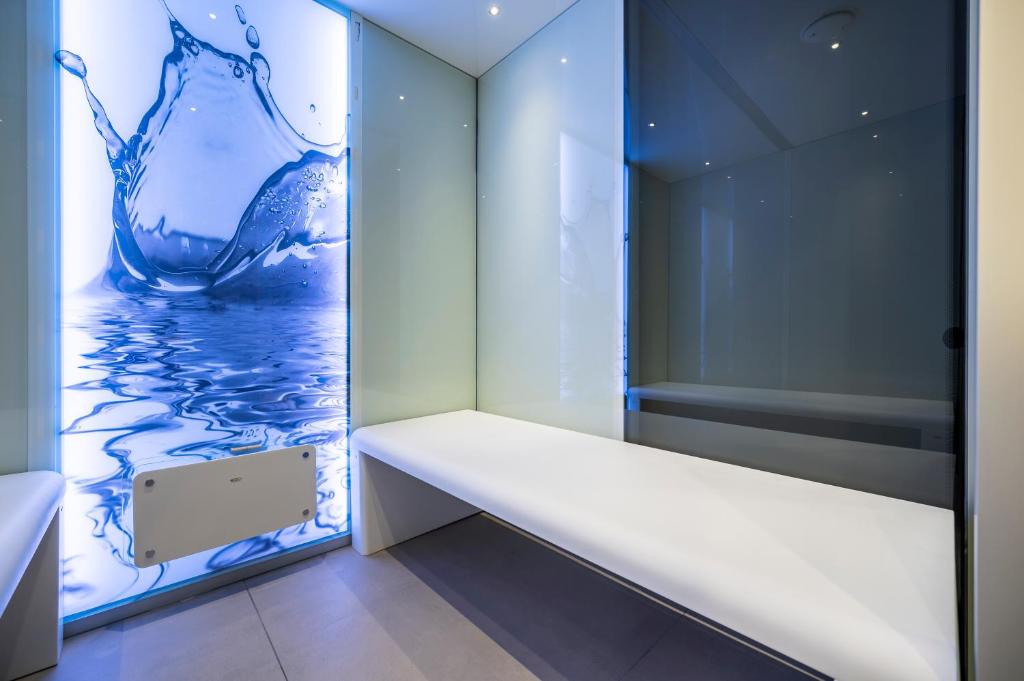 A bed or beds in a room at VIZUALIZA Residence Hotel