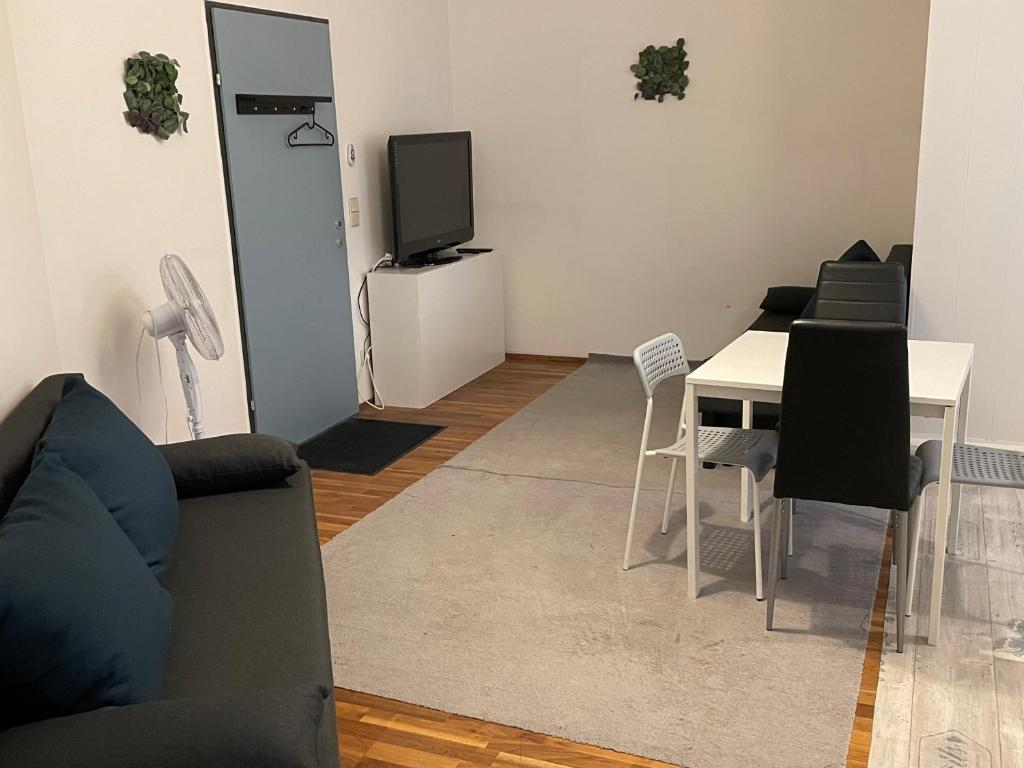 TV a/nebo společenská místnost v ubytování Veni Apartments