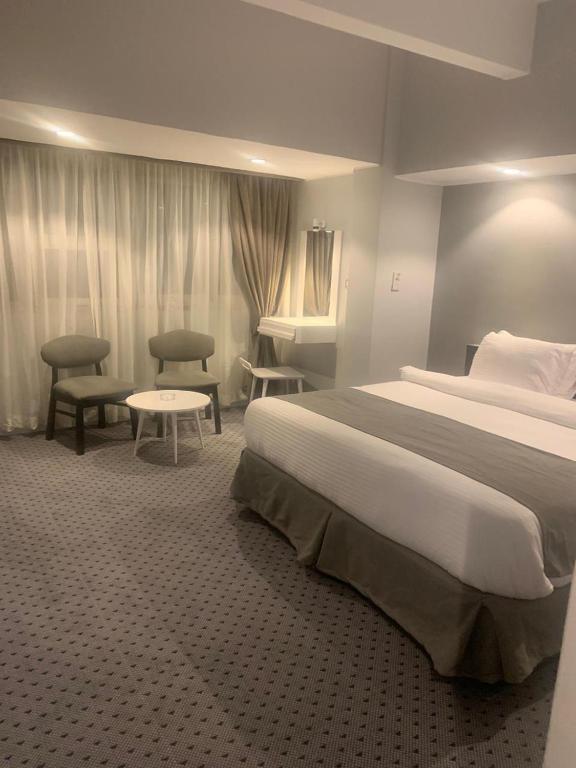 Postel nebo postele na pokoji v ubytování Atlas International Hotels