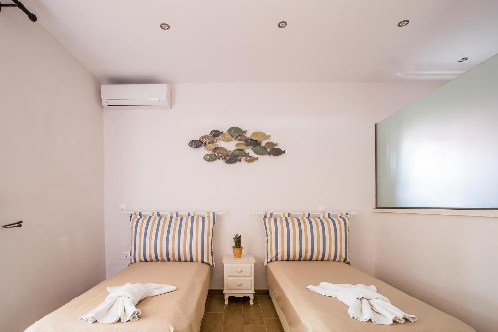 Postel nebo postele na pokoji v ubytování Spiti Prifti Apartments
