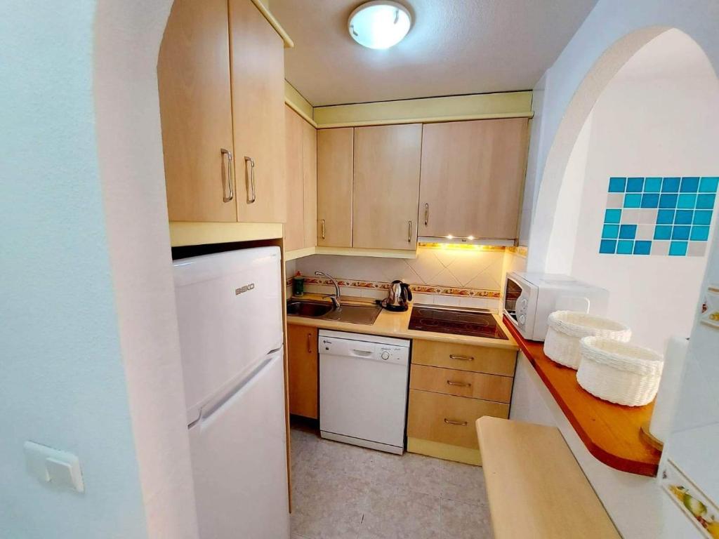 A kitchen or kitchenette at Mira apartman