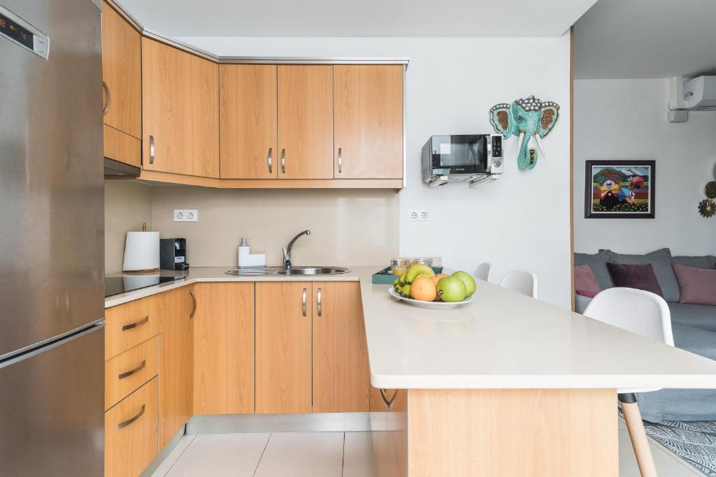Kuchyň nebo kuchyňský kout v ubytování Home2Book El Perenquén Las Canteras