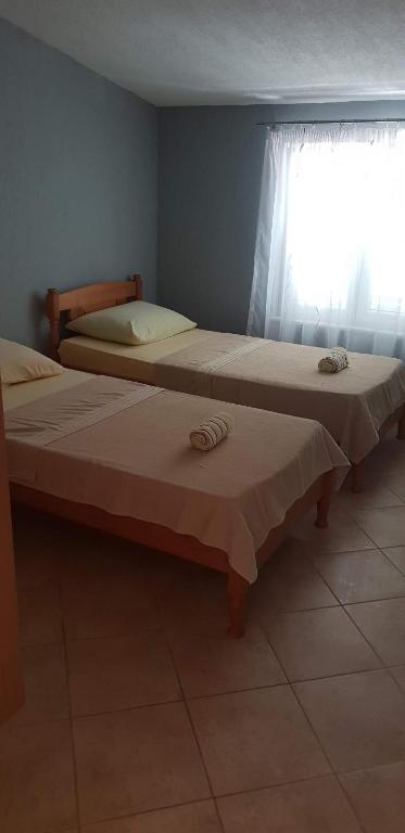 Posteľ alebo postele v izbe v ubytovaní Apartments Pralija