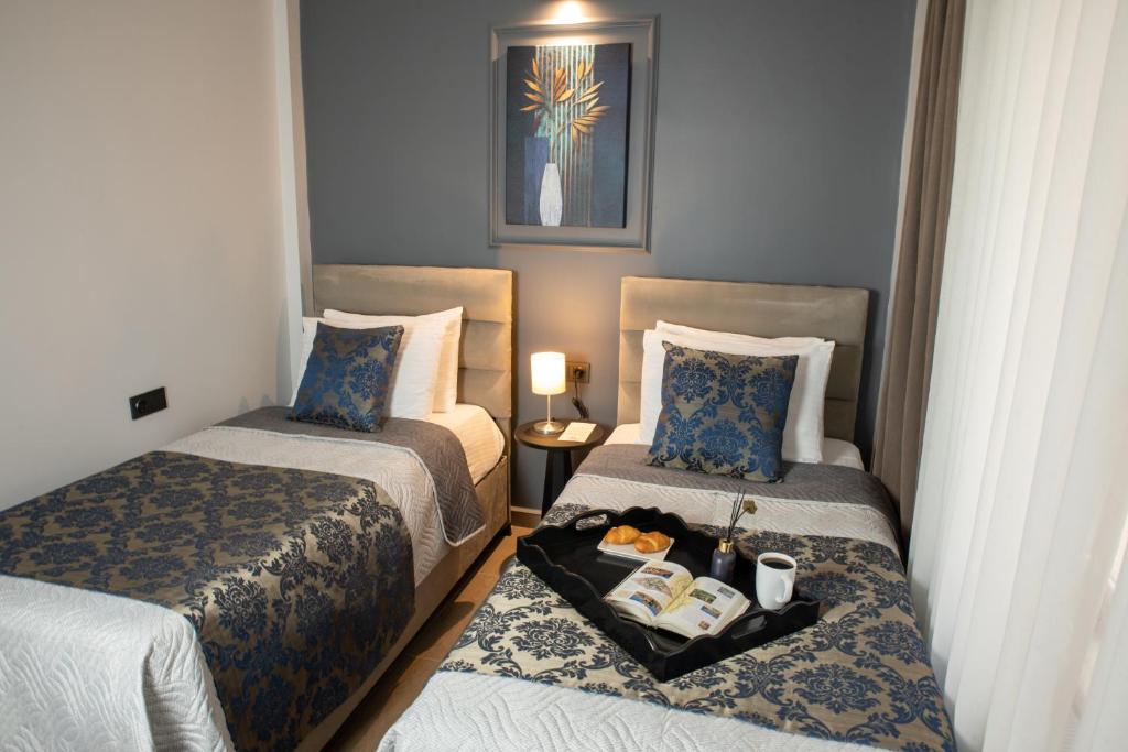 Postel nebo postele na pokoji v ubytování 12 rooms hotel