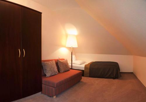 Postel nebo postele na pokoji v ubytování Tandreas Hotel & Restaurant