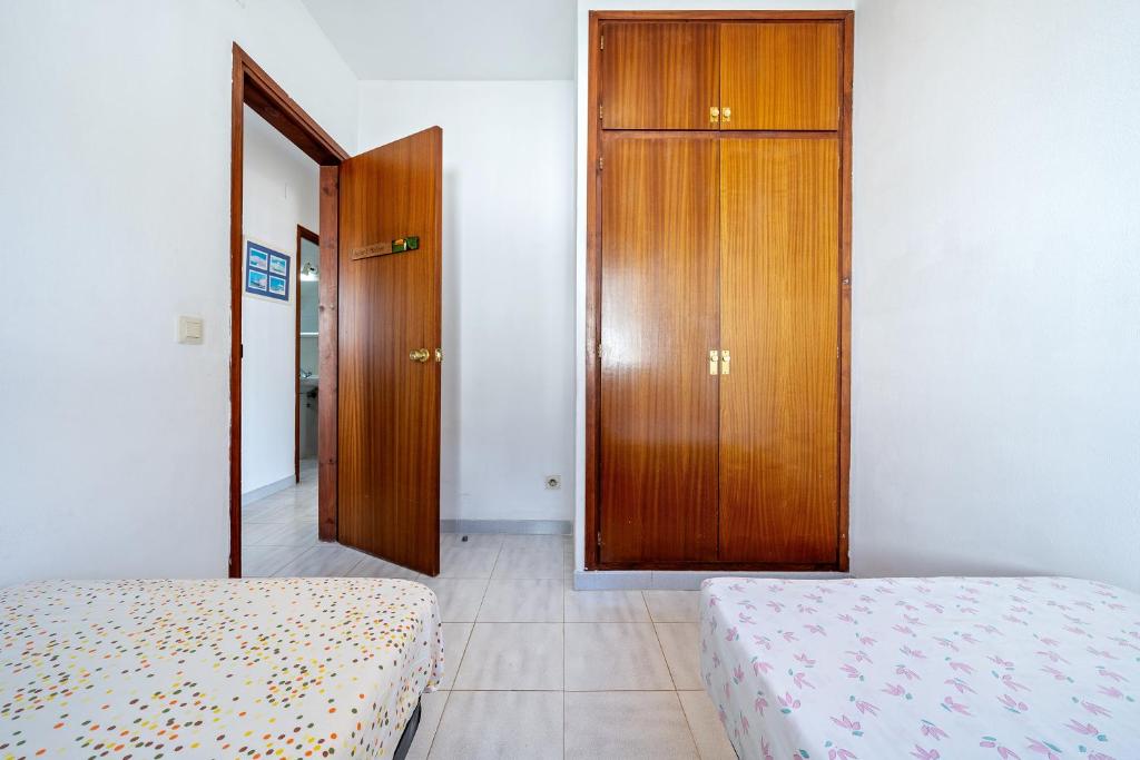 Posteľ alebo postele v izbe v ubytovaní Coma-ruga