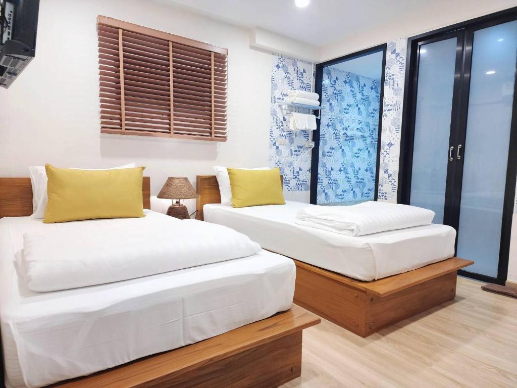 Cama ou camas em um quarto em Sleep Walker Poshtel