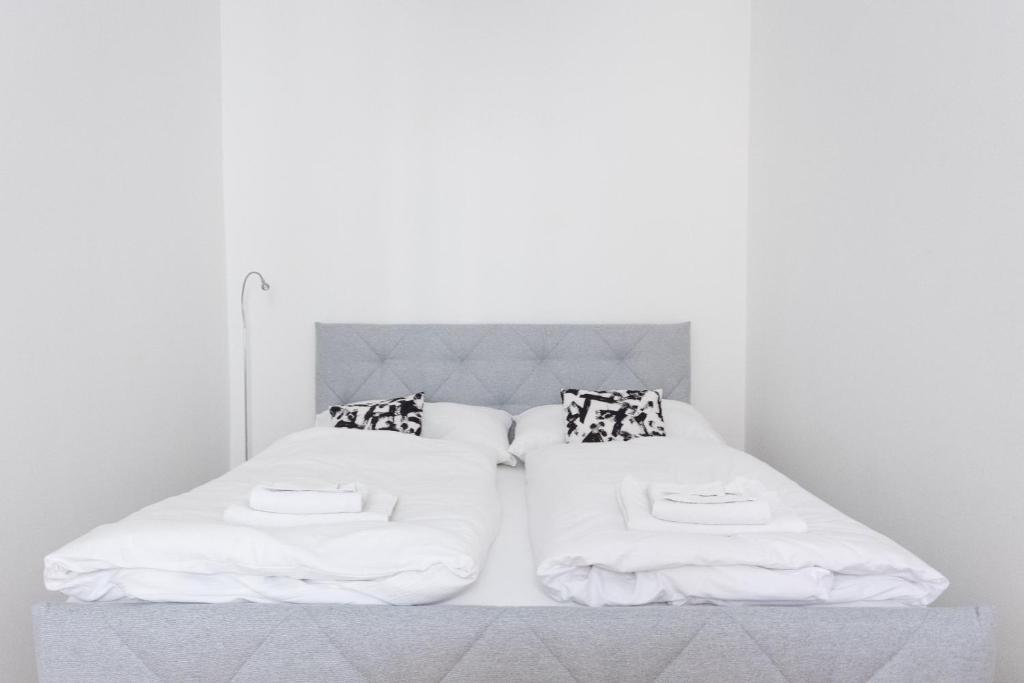 Łóżko lub łóżka w pokoju w obiekcie Vienna City Apartments Krongasse