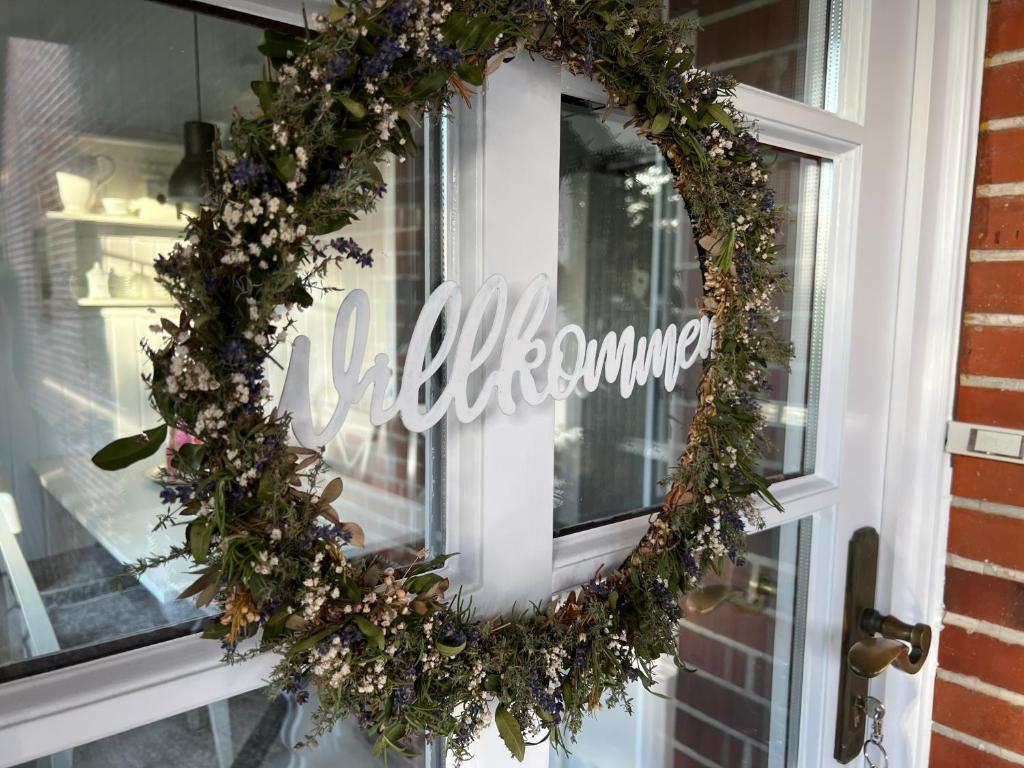 a christmas wreath on a door of a store at Ferienwohnung zur alten Post 