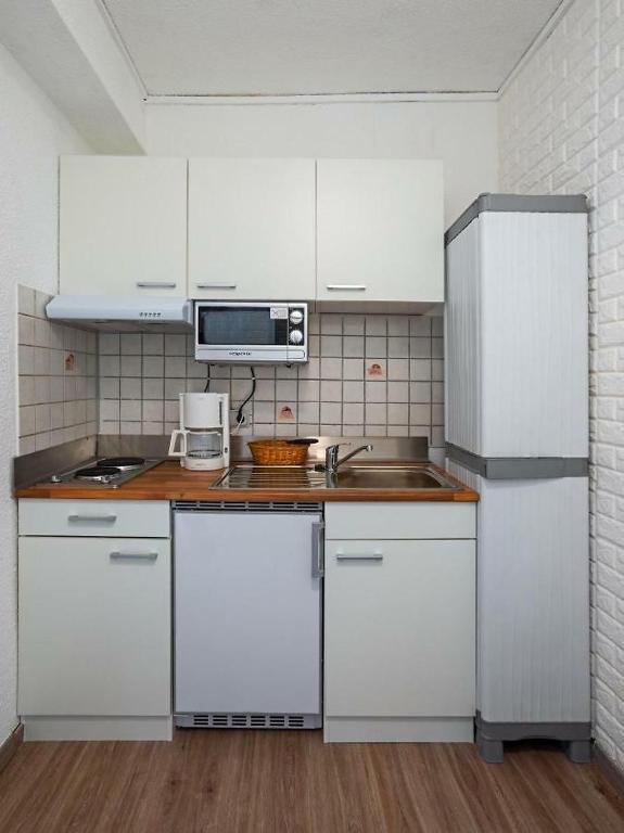 Kuchyň nebo kuchyňský kout v ubytování Park Hotel