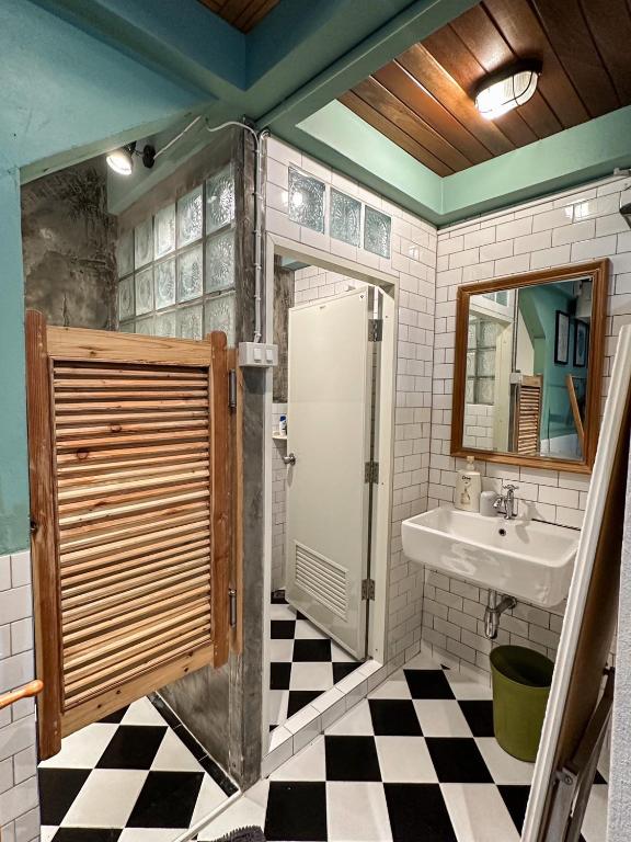 a bathroom with a sink and a shower and a mirror at T-House BKK 2Floors near BTS with swimming pool and free Wifi in Klong Toi