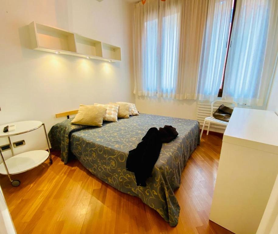 Ein Bett oder Betten in einem Zimmer der Unterkunft Salmaso Apartments