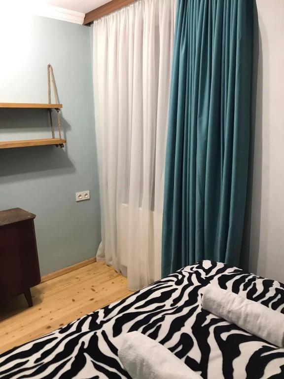 Postel nebo postele na pokoji v ubytování Friendly House