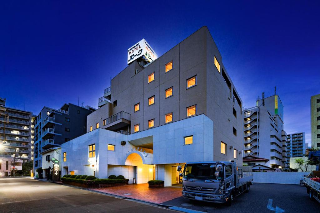 a truck is parked in front of a building at Kawasaki Hotel Park in Kawasaki