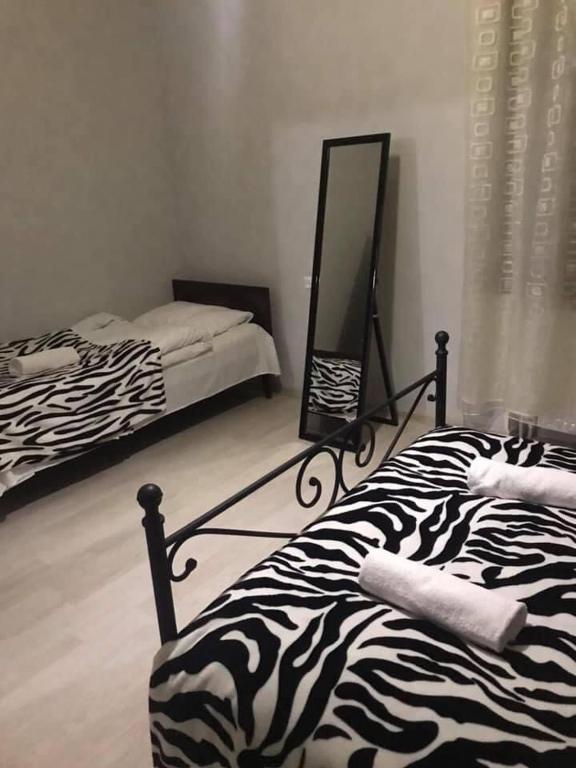 Postel nebo postele na pokoji v ubytování Friendly House