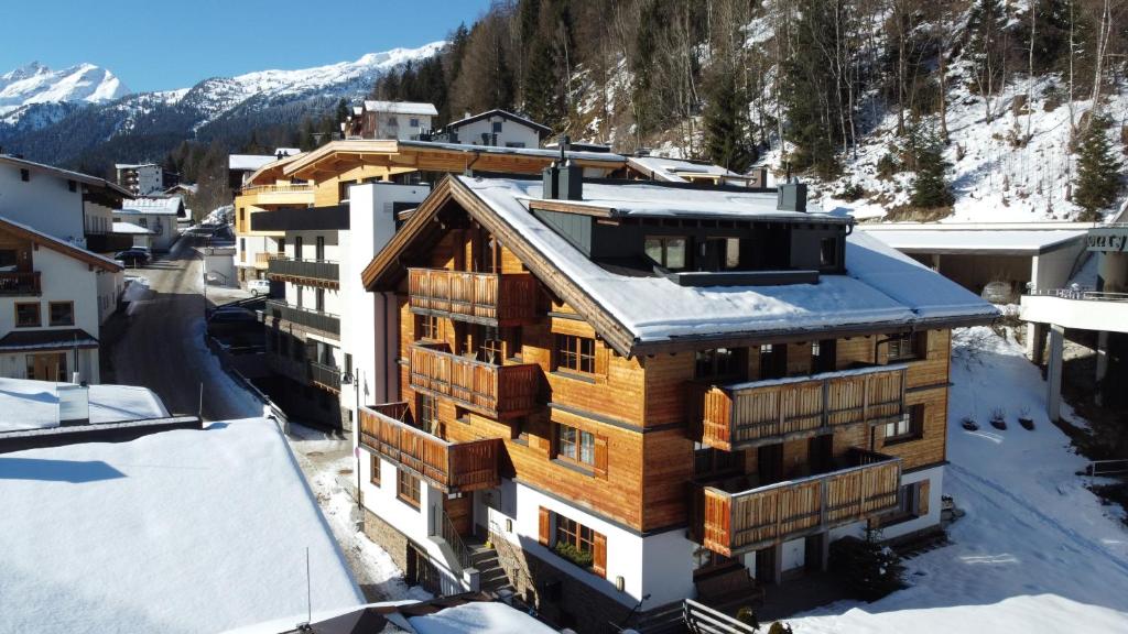 an aerial view of a building in the snow at ARLhome Lodge - Zuhause am Arlberg in Sankt Anton am Arlberg