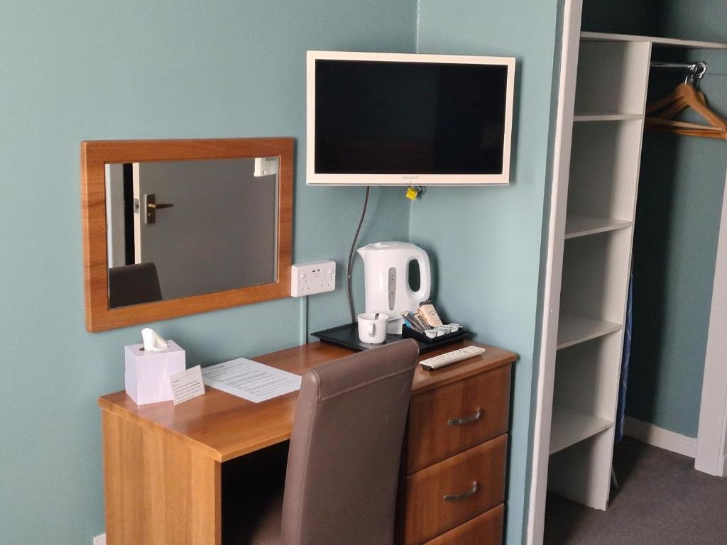 TV a/nebo společenská místnost v ubytování Dunmuir Hotel