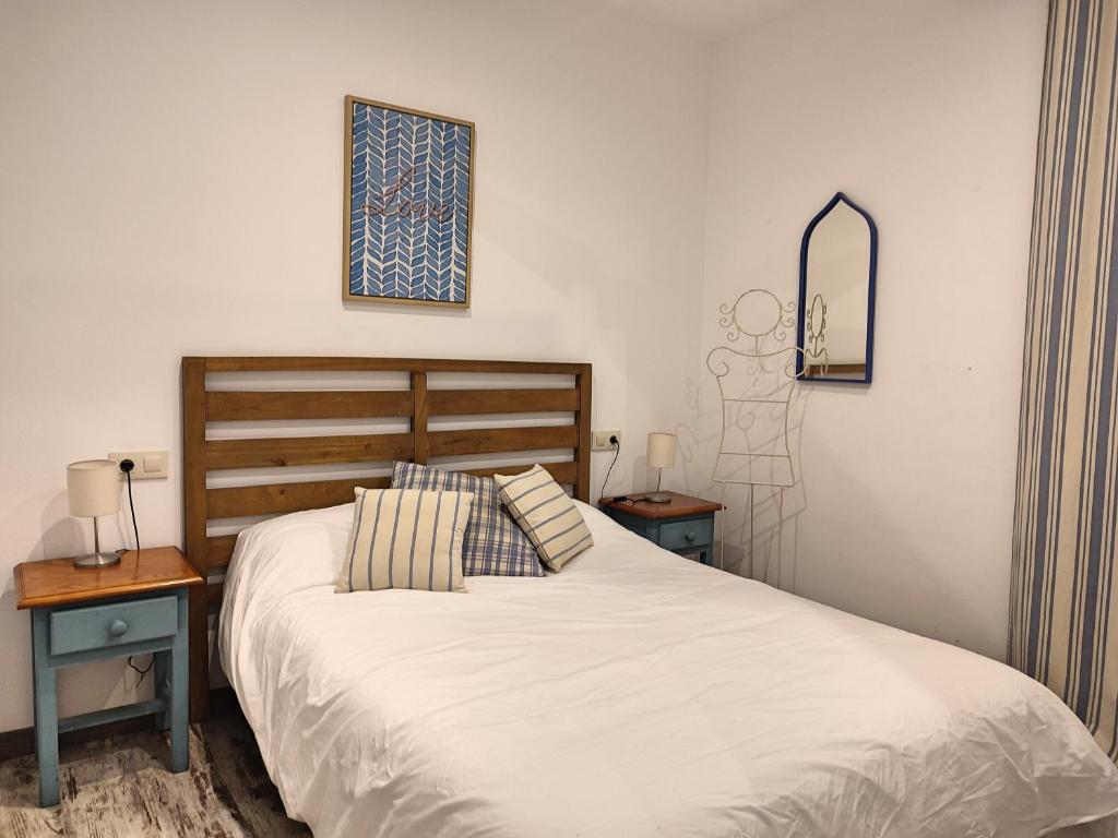 Posteľ alebo postele v izbe v ubytovaní La Casa de Pedro Verdugo Apartamento Turístico