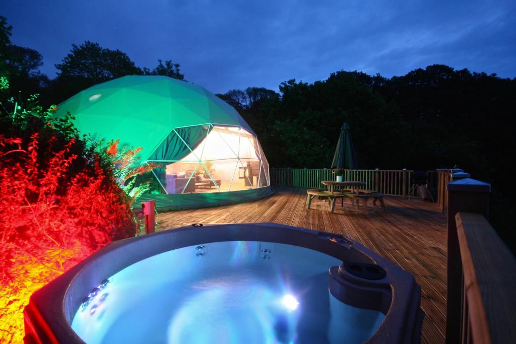 aented igloo with a hot tub and a tent at Sunridge Geodome with private Hot tub in Plymouth