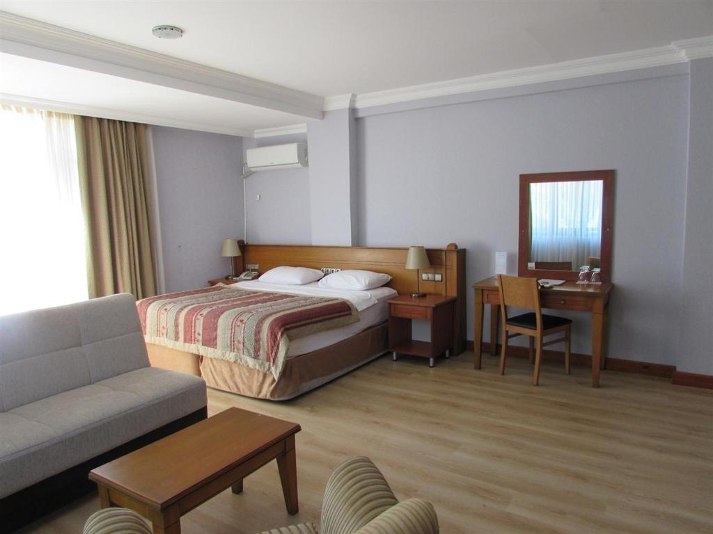 Postel nebo postele na pokoji v ubytování Green Mount Hotel