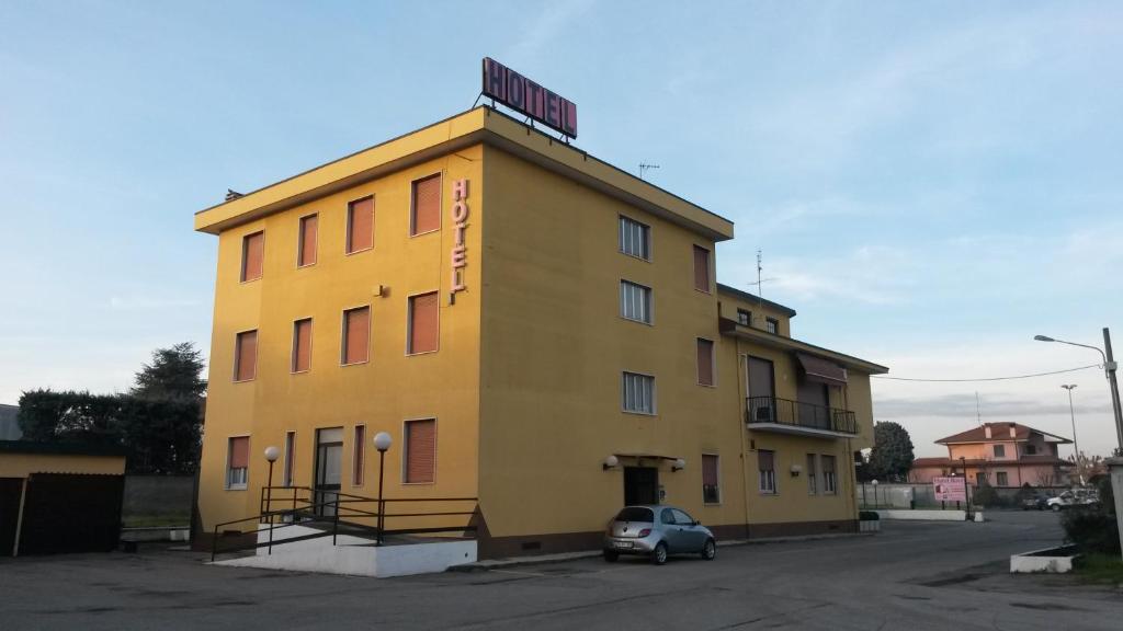 
a large building with a large window on the side of it at Hotel Rosy in Arluno
