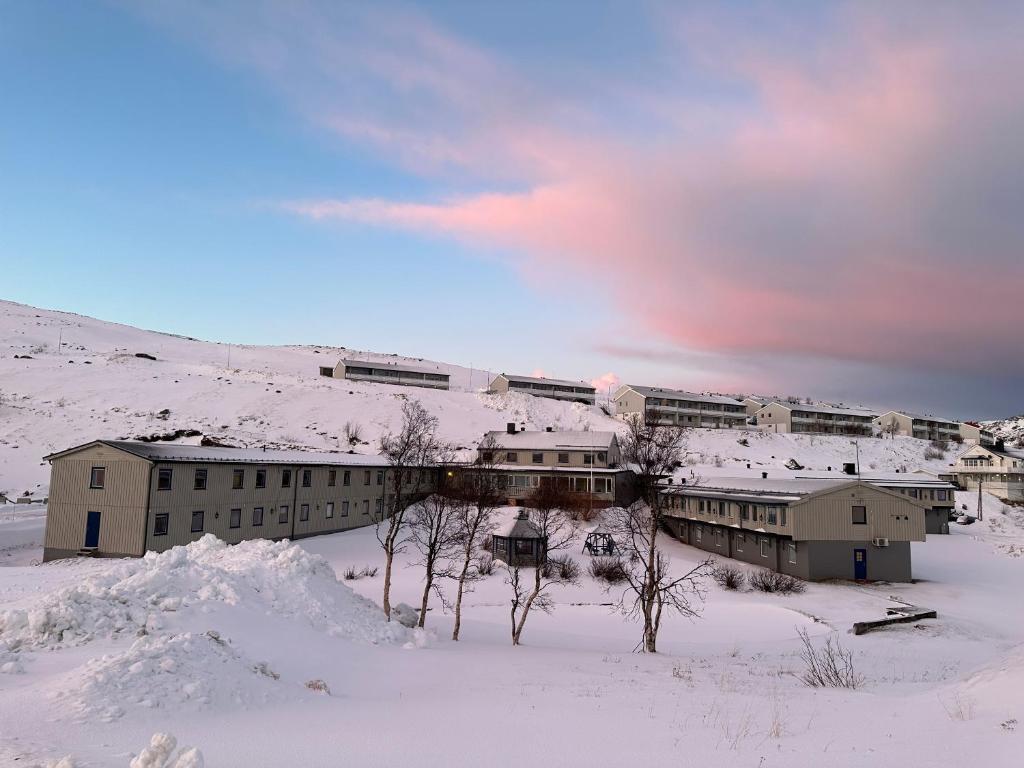 a group of buildings in the snow at Camp Skytterhuset in Hammerfest