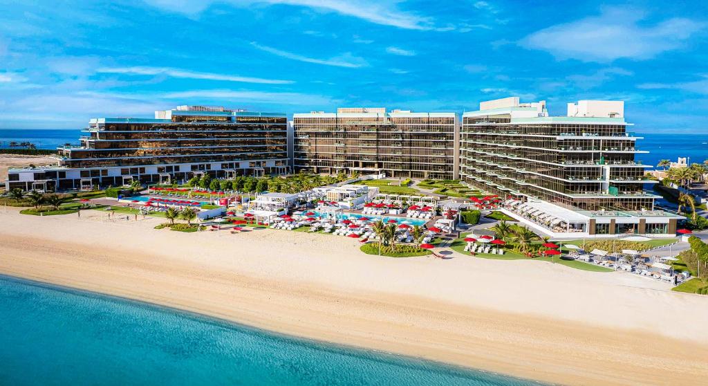 an aerial view of a resort on the beach at Th8 Palm Dubai Beach Resort Vignette Collection, an IHG hotel in Dubai