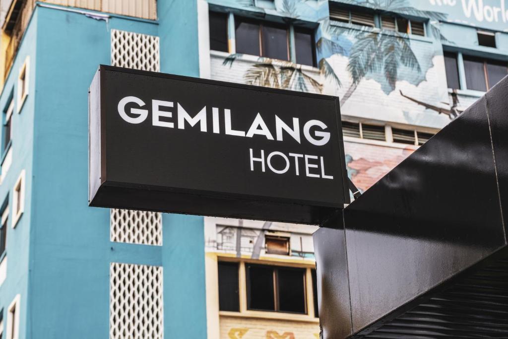 a sign for a gemilining hotel in front of a building at Gemilang Hotel in Kota Kinabalu
