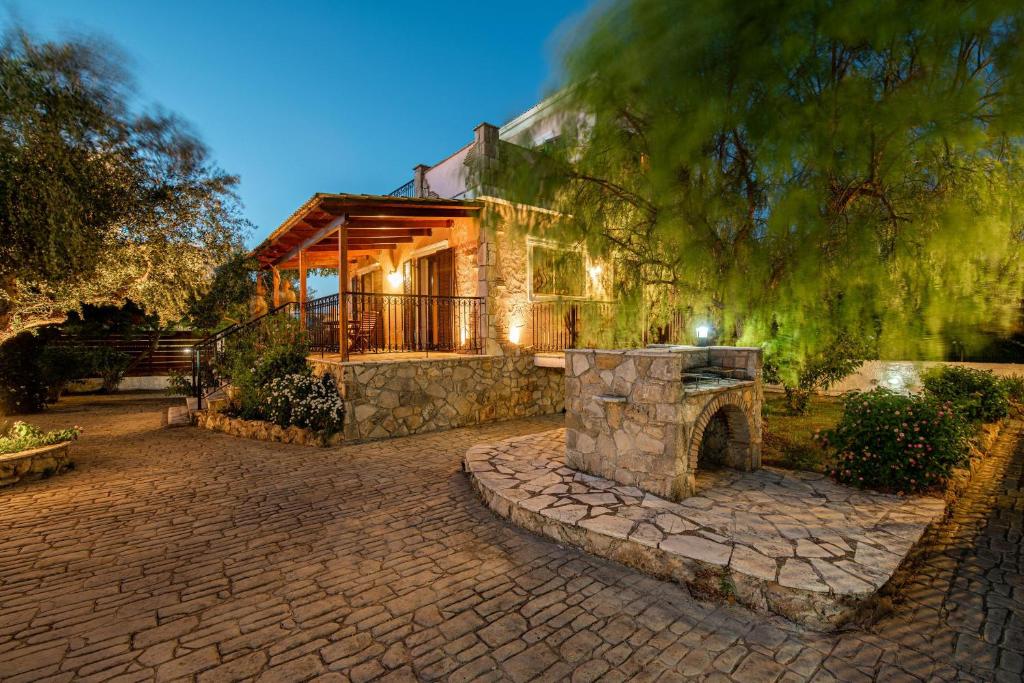 A garden outside Olive Tree Villas