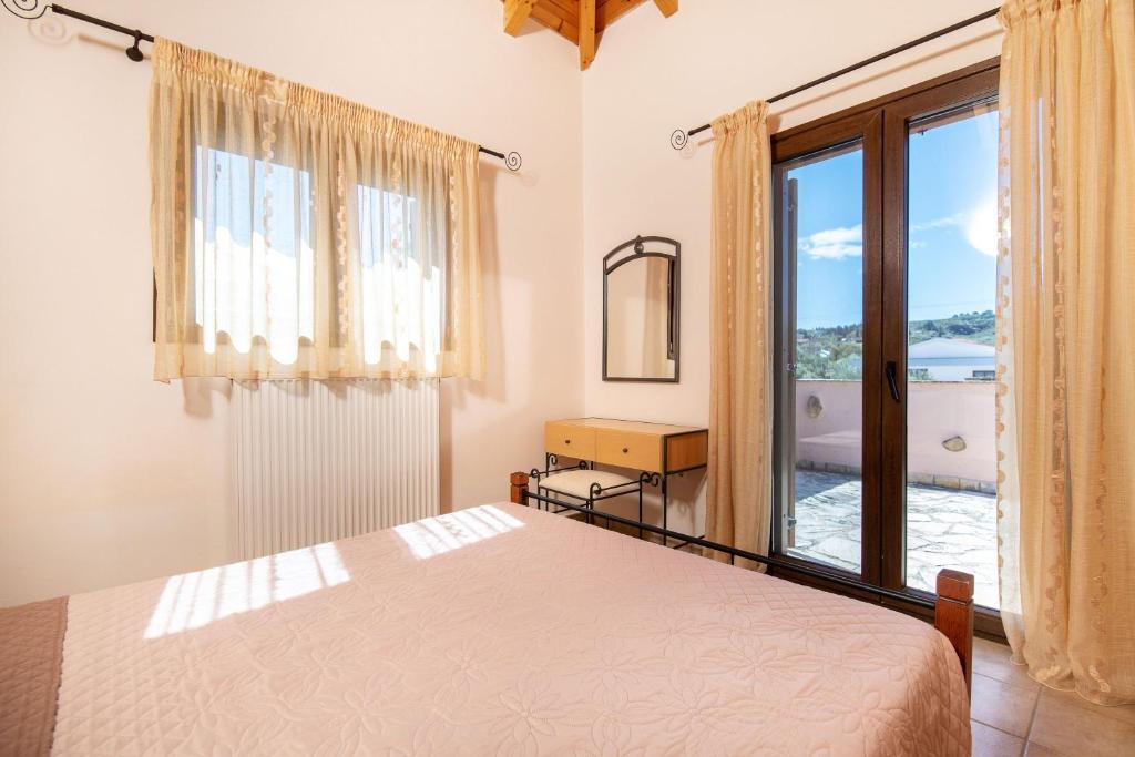 A bed or beds in a room at Olive Tree Villas