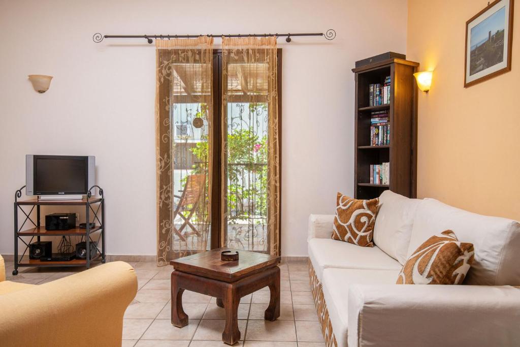 A television and/or entertainment centre at Olive Tree Villas