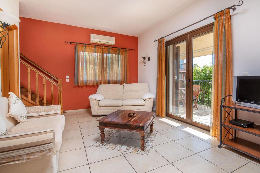 A television and/or entertainment centre at Olive Tree Villas