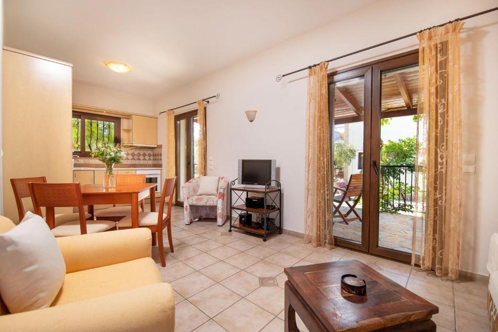 A television and/or entertainment centre at Olive Tree Villas